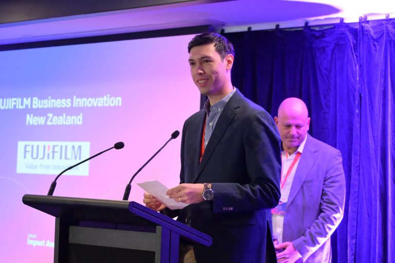 Kenzo Hosomi receiving the award on behalf of FBNZ